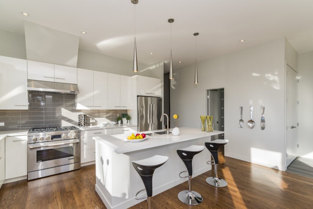 Updated kitchen with new cabinets, stainless steel appliances, and natural lighting.